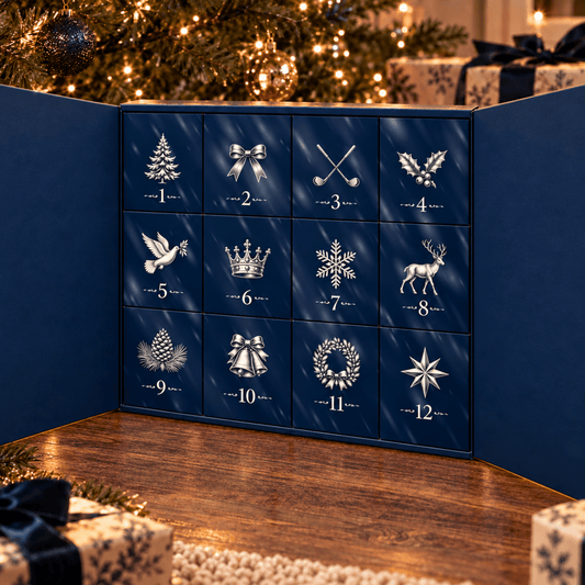 Golf ball advent calendar opened to show twelve numbered navy doors with festive icons