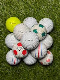 Mixed premium golf balls in B and C grade on grass