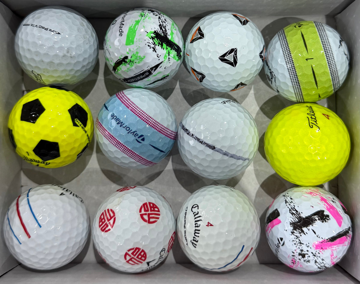 Mixed A-grade golf balls including a Callaway Truvis and a yellow Titleist