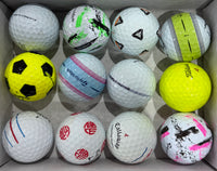 Mixed A-grade golf balls including a Callaway Truvis and a yellow Titleist