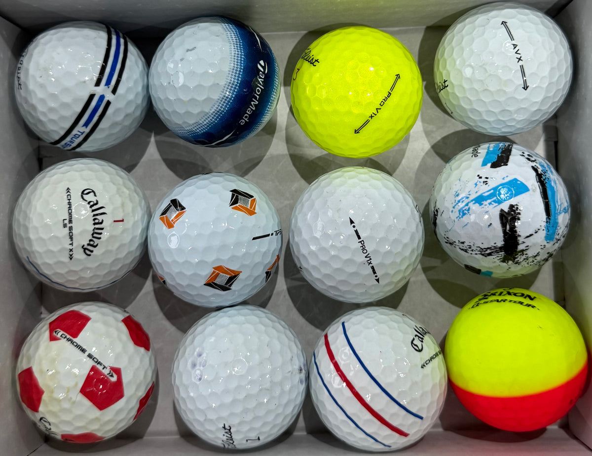 A-grade golf balls including TaylorMade, Callaway and a two-tone orange ball