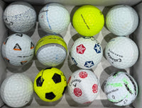 A-grade golf balls in a tray including yellow and Truvis patterned designs